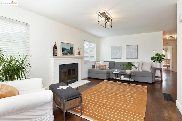 living room with dark hardwood / wood-style flooring