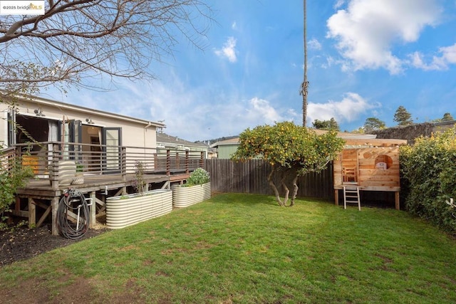 view of yard featuring a deck