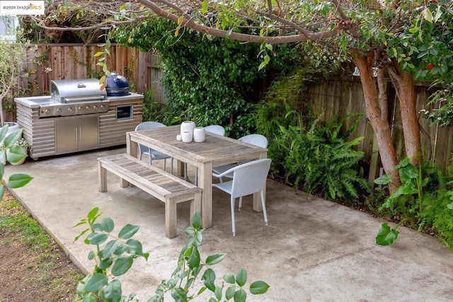 view of patio with a grill and area for grilling