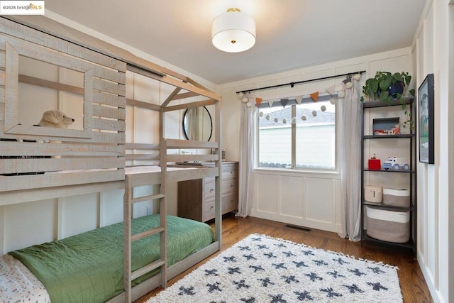 bedroom with hardwood / wood-style floors