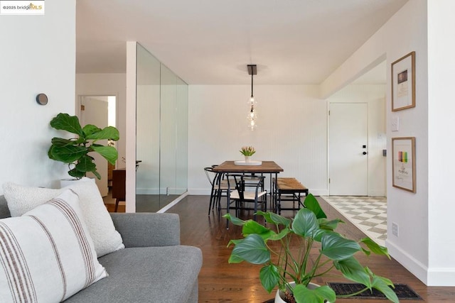 dining area featuring dark wood-type flooring