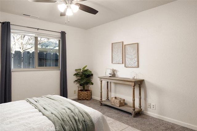 carpeted bedroom featuring visible vents, ceiling fan, and baseboards