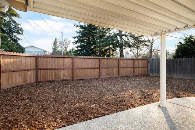 view of yard with a patio area and a fenced backyard