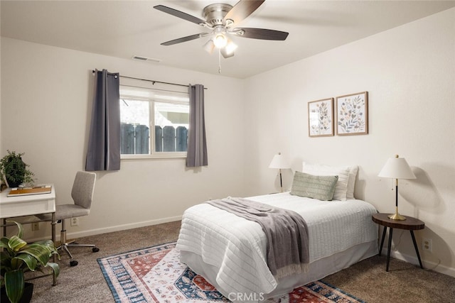 carpeted bedroom with visible vents, ceiling fan, and baseboards