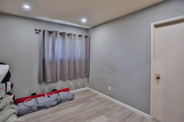 unfurnished bedroom with light wood-type flooring