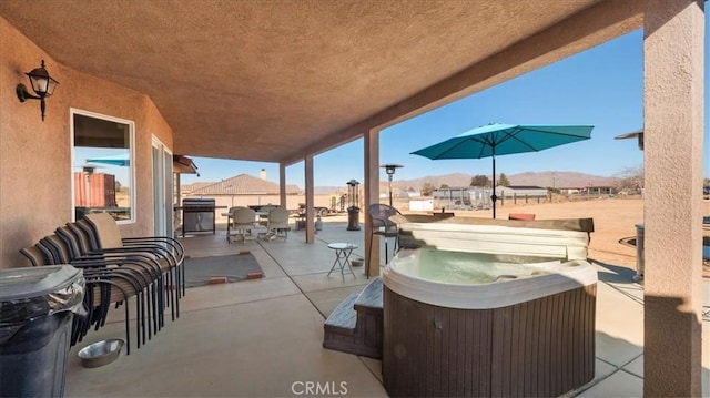 view of patio with a hot tub