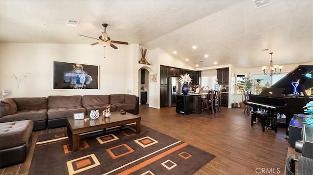 living room featuring lofted ceiling, ceiling fan with notable chandelier, and dark hardwood / wood-style flooring