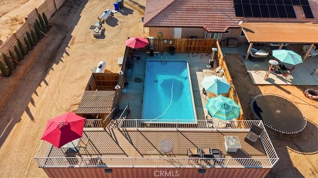 view of pool with fence