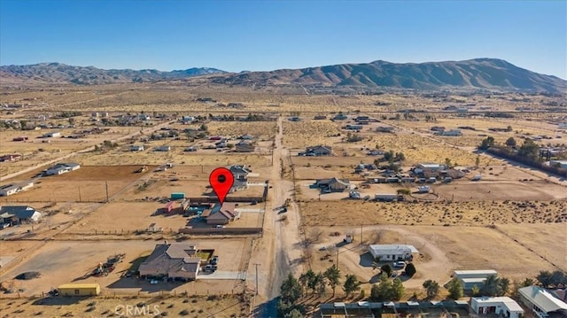 drone / aerial view featuring a mountain view