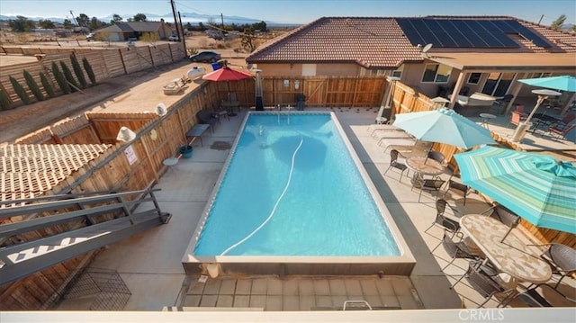 view of pool featuring a patio area