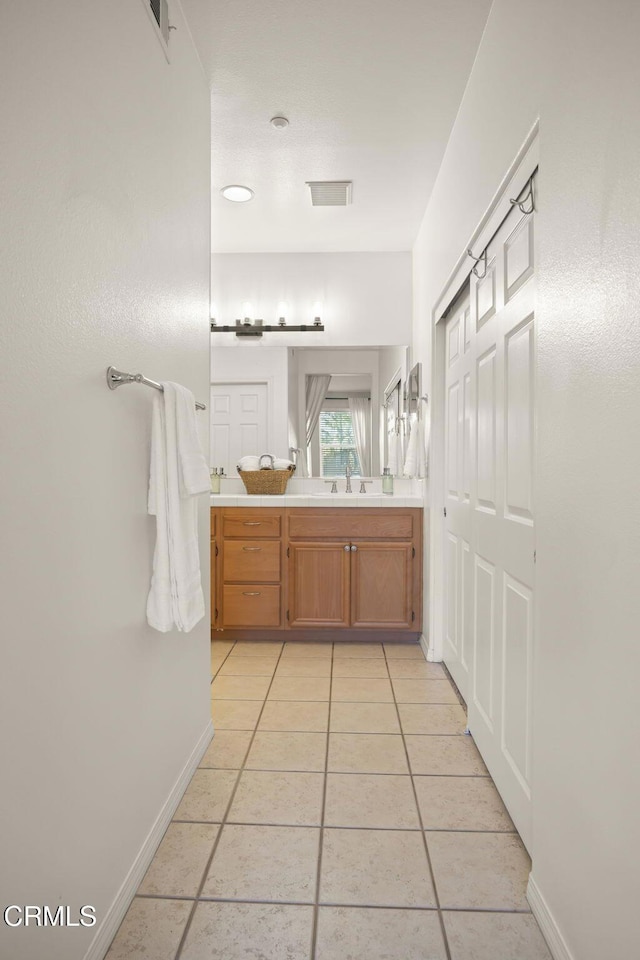 bathroom featuring vanity and tile patterned flooring