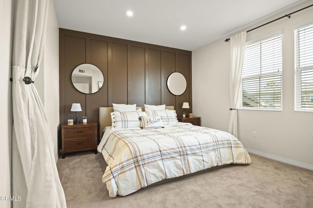 bedroom featuring light colored carpet