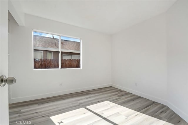 13031 Eyota Dr, Moreno Valley, CA 92555 - unfurnished room featuring wood finished floors and baseboards