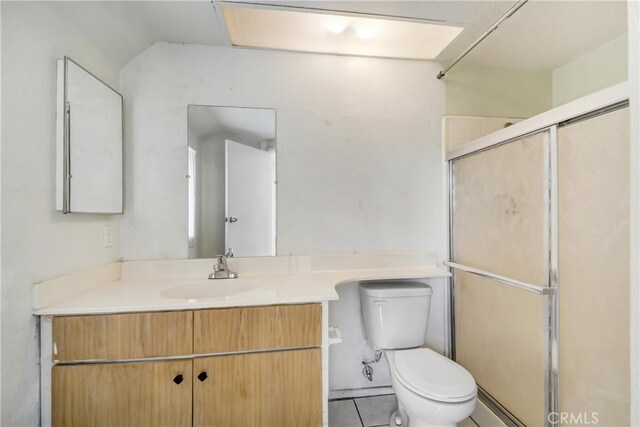 13031 Eyota Dr, Moreno Valley, CA 92555 - bathroom with a shower stall, toilet, vanity, and tile patterned floors