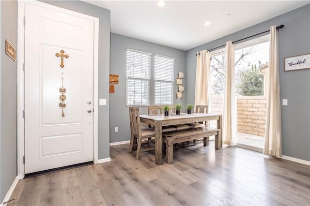 dining space featuring light wood-type flooring