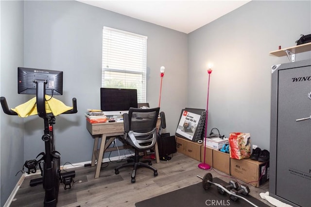 home office with hardwood / wood-style floors