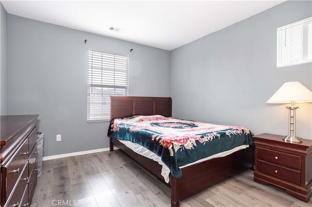 bedroom with light wood-type flooring