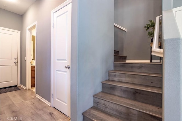 staircase featuring wood-type flooring