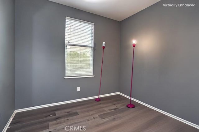 spare room featuring hardwood / wood-style flooring