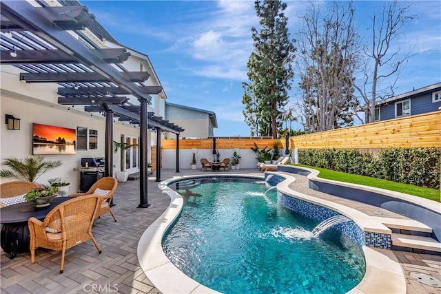 view of pool with pool water feature, a pergola, and a patio