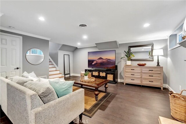 living room featuring crown molding and dark hardwood / wood-style floors