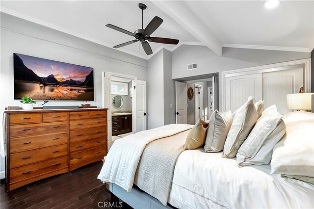 bedroom featuring ensuite bath, ceiling fan, vaulted ceiling with beams, dark hardwood / wood-style floors, and a closet