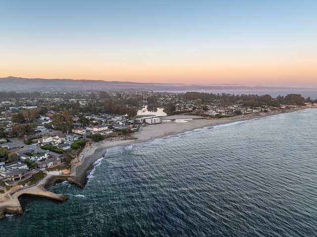 aerial view at dusk with a water view