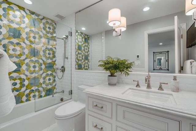 full bathroom featuring tasteful backsplash, enclosed tub / shower combo, vanity, and toilet