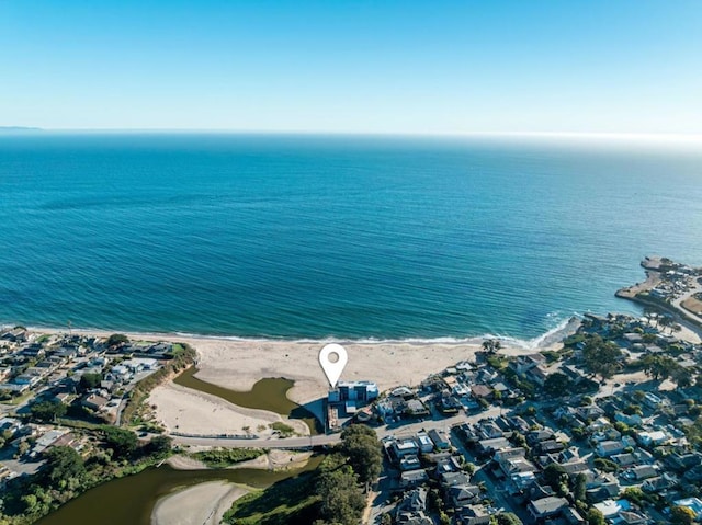 bird's eye view with a beach view and a water view