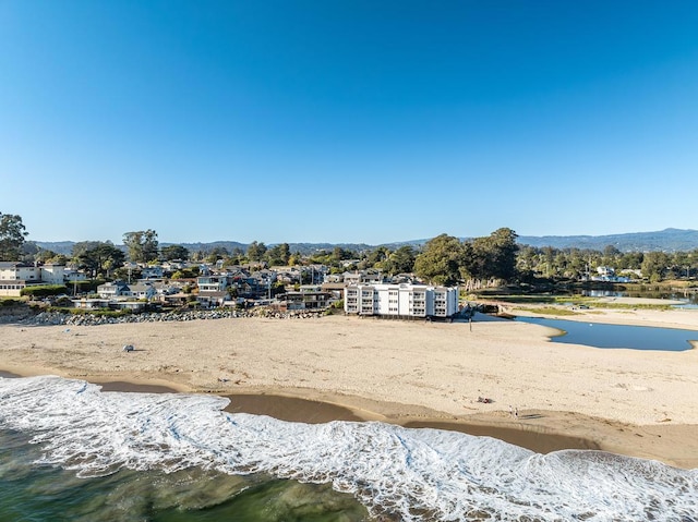 bird's eye view with a beach view and a water view