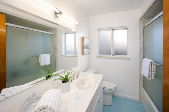 full bathroom with shower / bath combination with glass door, vanity, toilet, and tile patterned flooring