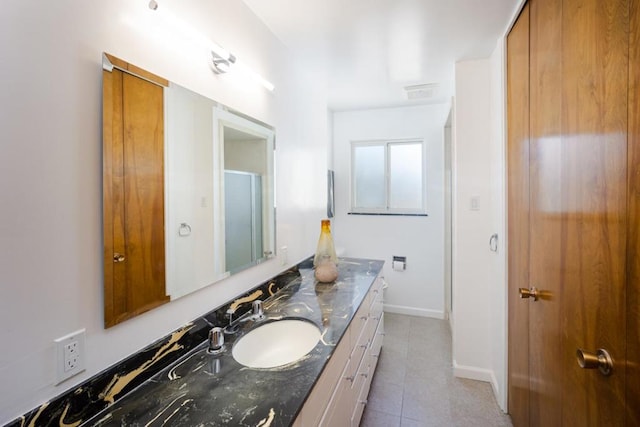 bathroom with vanity and tile patterned floors