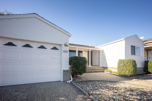 ranch-style home featuring a garage