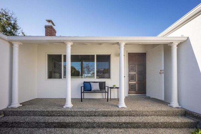 entrance to property with covered porch