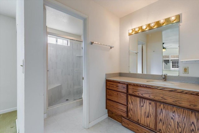 bathroom with vanity and a shower with door