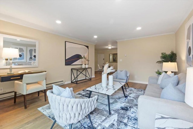 living room featuring wood-type flooring, ornamental molding, and baseboard heating