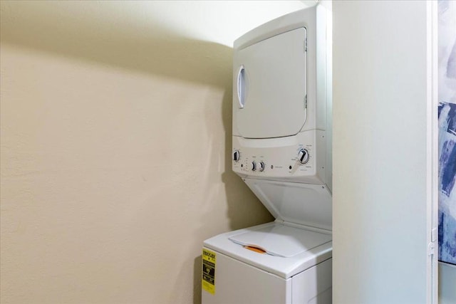 laundry area featuring stacked washer and dryer