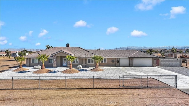 ranch-style house featuring a garage