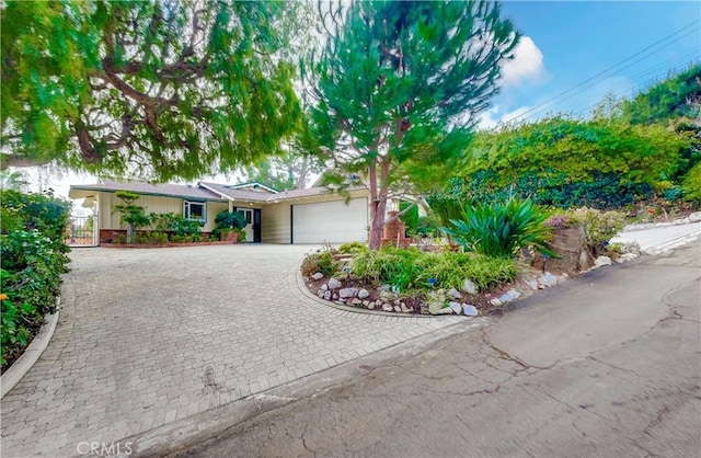 ranch-style house featuring a garage