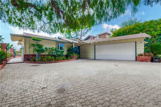 ranch-style home featuring a garage