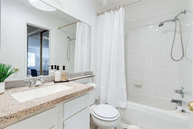 full bathroom with shower / tub combo, vanity, and toilet