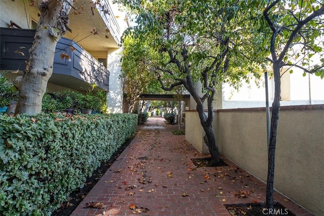 exterior space with a balcony and stucco siding