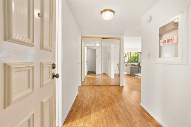 hall with light wood-type flooring