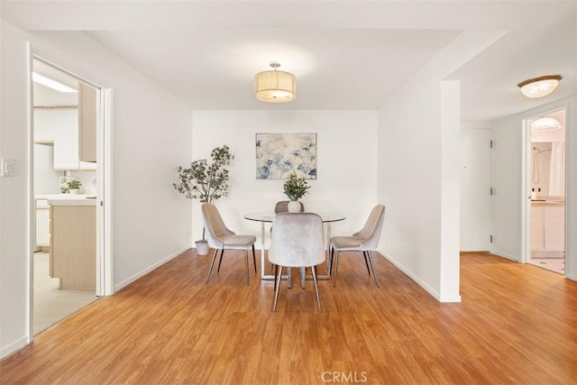 dining room with hardwood / wood-style flooring