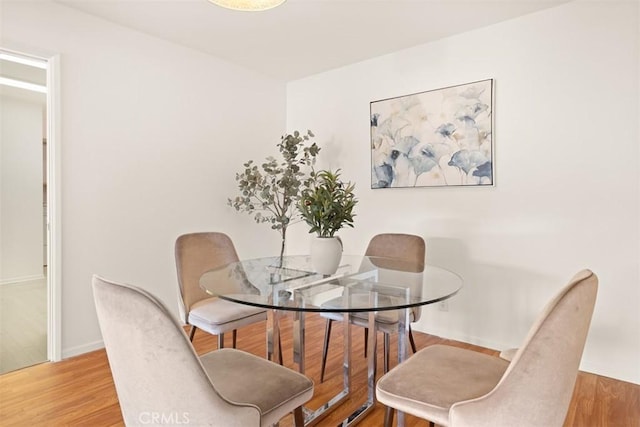 dining area featuring hardwood / wood-style floors