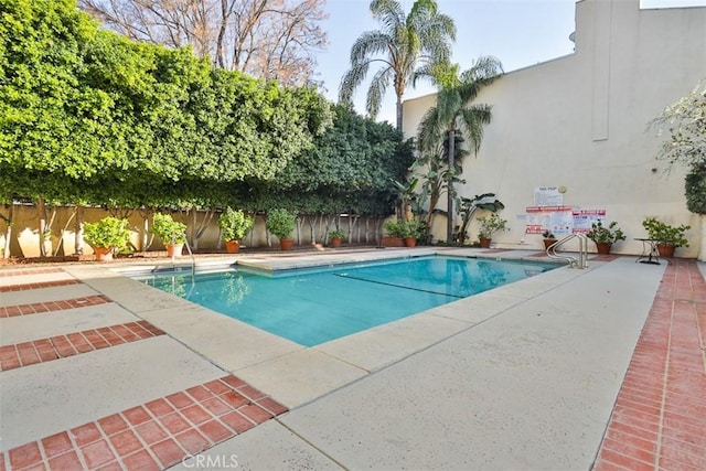 view of pool featuring a patio