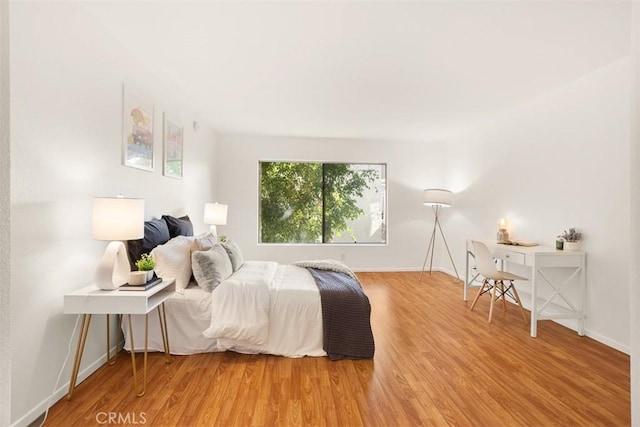 bedroom with wood-type flooring