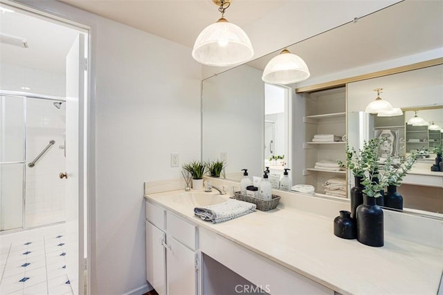 bathroom with vanity and an enclosed shower