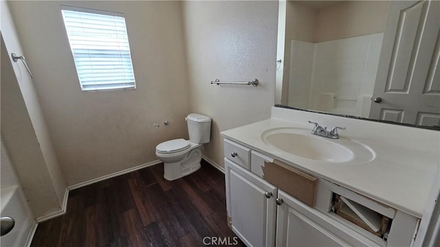 bathroom featuring hardwood / wood-style flooring, vanity, and toilet