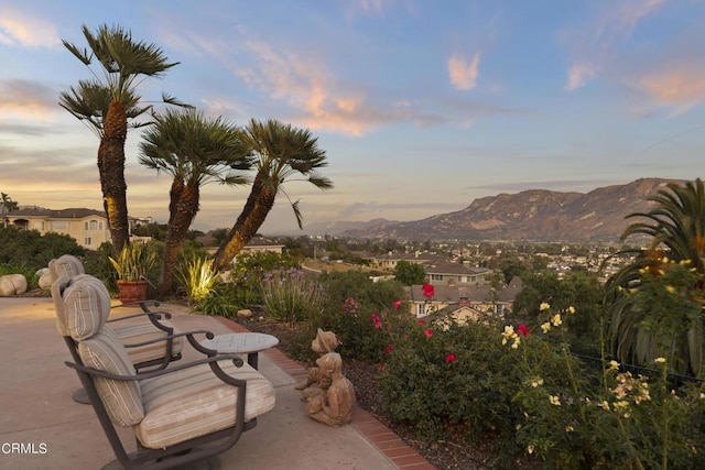 patio terrace at dusk with a mountain view